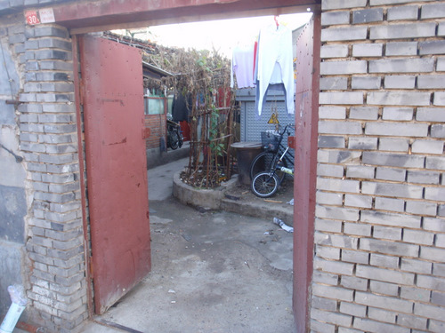 A peek into a Hutong Gate or Gateway, and the remaining Court Yard.
